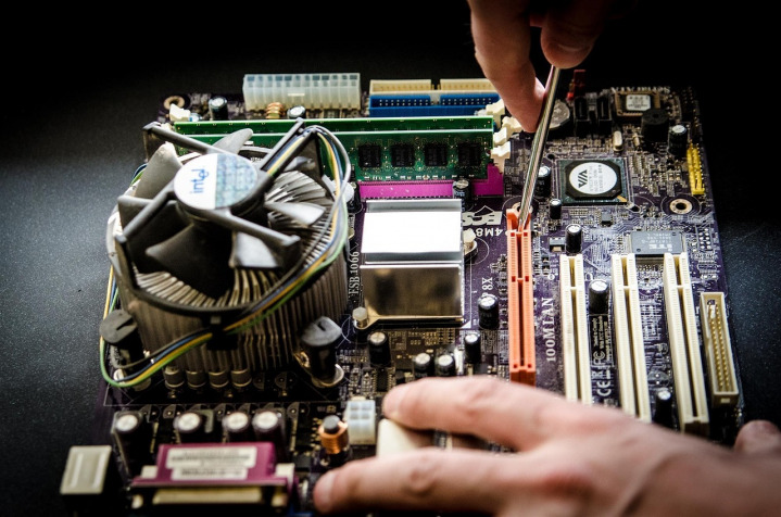 computer repair technician working